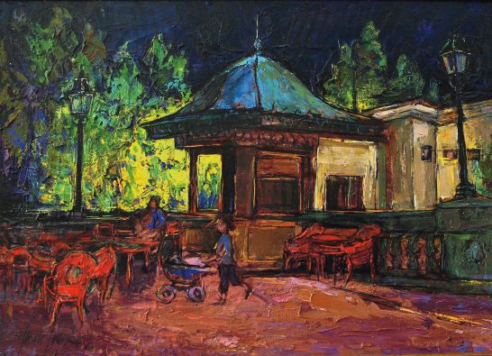 Wanchuen (mi hija) en el quiosco Escena nocturna con quiosco y personas en un parque iluminado.